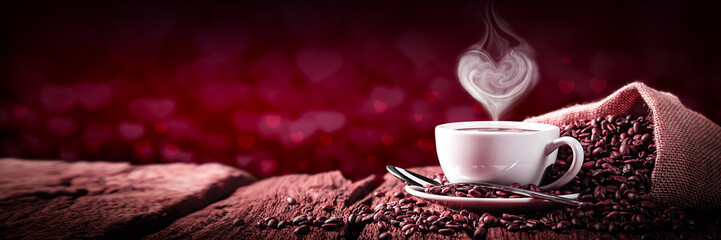  Coffee With Heart Shaped Steam On Old Weathered Table And Red Heart Bokeh Background - Valentine's Day Concept	