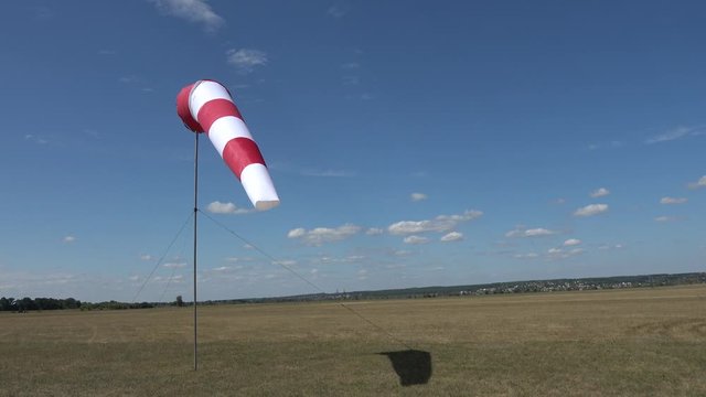 Korotych airdrome, Kharkov, Ukraine - 11th of August 2019: 4K Aerodrome wind sock on the field and the blue sky