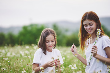 Fototapeta premium mother and daughter having fun in the park