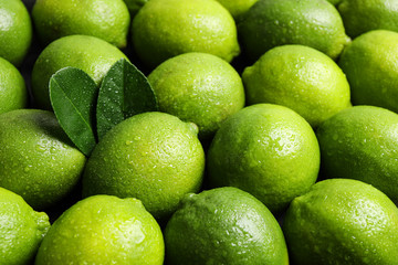 Fresh ripe juicy limes as background, closeup