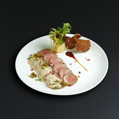 Dishes of traditional Russian cuisine. Restaurant serving. Black background.