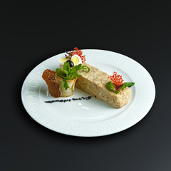 Dishes of traditional Russian cuisine. Restaurant serving. Black background.