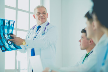 Medical team sitting and discussing at table