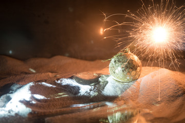 Christmas background with baubles, on snow, free space for text. Christmas decoration