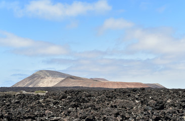 Volcanic landscape and volcano craters at Timanfaya National Park, Lanzarote, Canary Islands, Spain