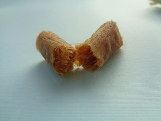 Klethik nanas, dry stir fry smash pineapple cover up with corn husk. Indonesian traditional snack, sweat snack