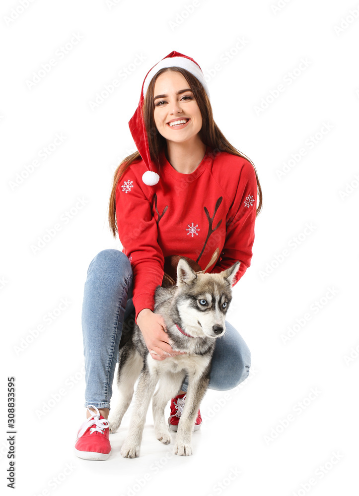 Canvas Prints cute woman in santa claus hat and funny husky puppy on white background