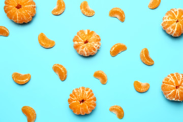 Sweet tangerines on color background