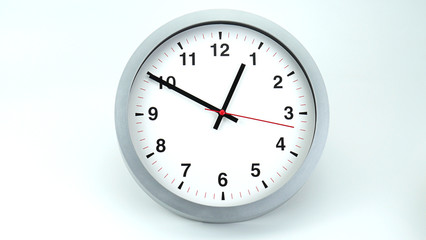 Gray wall clock face beginning of time 12.50 am or pm on White background, Copy space for your text, Time concept..