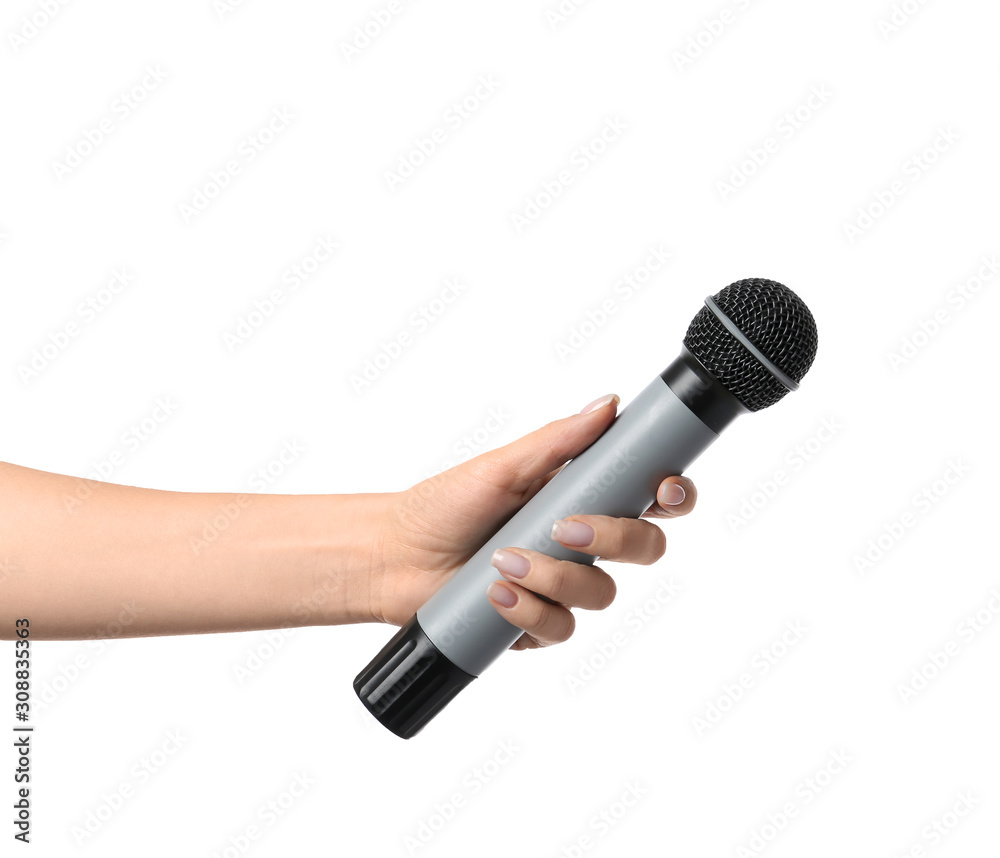 Wall mural female hand with microphone on white background