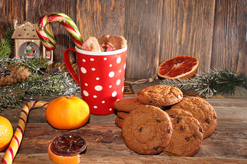 Christmas and New Year background with christmas trees, cocoa with marshmallows and oatmeal cookie on an old wooden background. New Year card for congratulations, selective focus, banner, rustic style