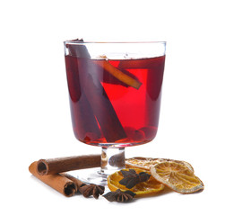 Glass of tasty mulled wine on white background