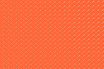 bright orange leather background with imitation weave texture. Glossy dermantine, artificial leather structure.