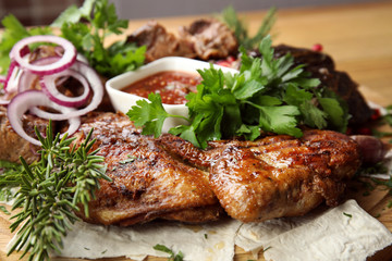 Delicious roasted chicken tobacco with herbal on wooden board, closeup