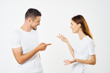 young couple in t-shirts chatting