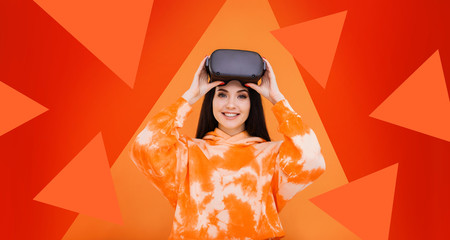 Portrait of beautiful woman in glasses of virtual reality. Augmented reality, future technology concept. VR. Bright geometric trendy background. Free space for text. Trends 2020.