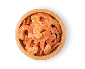 Dried shrimp in a wooden bowl on a white background. Top view