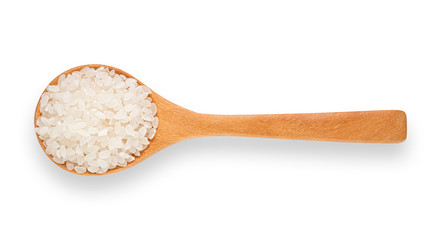 Rice in a wooden spoon on a white background. Top view