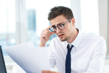 businessman talking on phone in his office