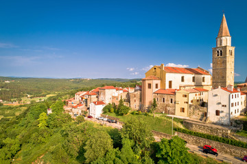 Fototapeta na wymiar Old stone town of Buje on green hill aerial view