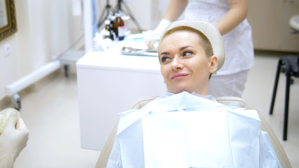 A woman visit to the dentist. woman smiling in the dentist chair.