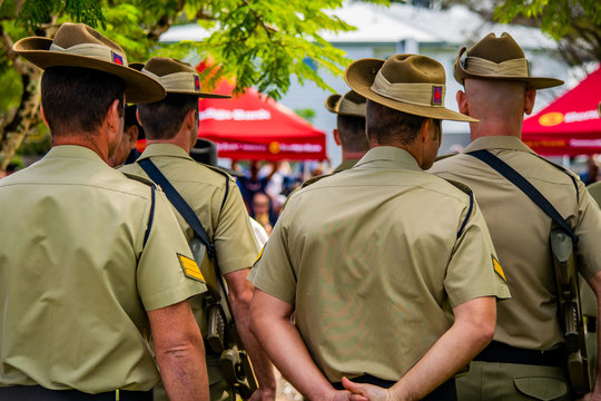 Small group of uniformed Australian Army soldiers waiting to march onto the Cenotaph during ANZAC Day service in Cooroy, near Noosa in Queensland