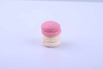 Tasty macarons on white background