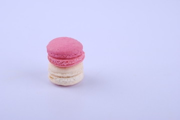 Tasty macarons on white background