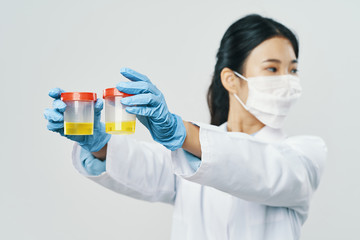 scientist in laboratory with test tubes