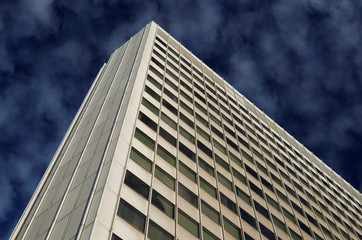 Fototapeta na wymiar white office building against deep blue cloudy sky in cologne