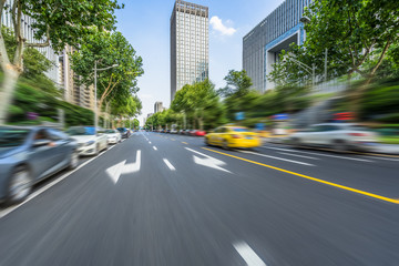 city road through modern buildings in nanjing