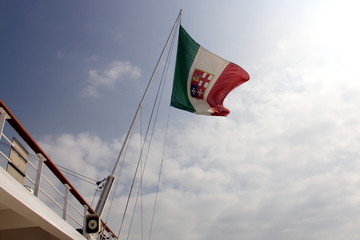 Italian nautical flag flying on the pole