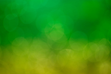 Abstract background. Distribution of white bokeh on a delicate green background  