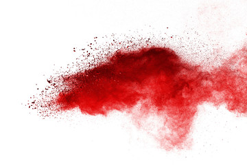 Red powder explosion on white background. Colored cloud. Colorful dust explode. Paint Holi.