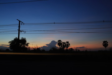 silhouette of side road at sunset