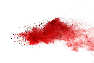 Red powder explosion on white background. Colored cloud. Colorful dust explode. Paint Holi.