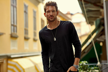 Portrait of handsome man in glasses posing outdoor