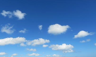 Blue sky with beautiful white fluffy clouds, natural background