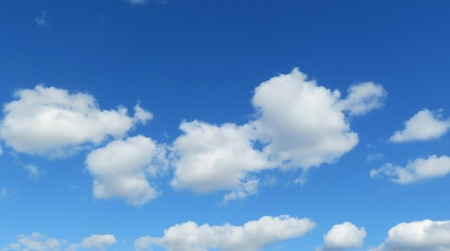Beautiful round clouds in blue sky, natural background © natalya2015