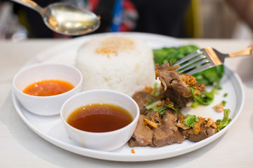 Selective focus of Roast beef  on rice Thai style