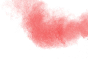 Red powder explosion on white background. Paint Holi.