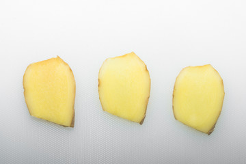 Ginger slices on a white background