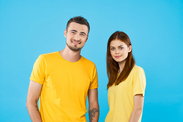 portrait of young couple on blue sky background