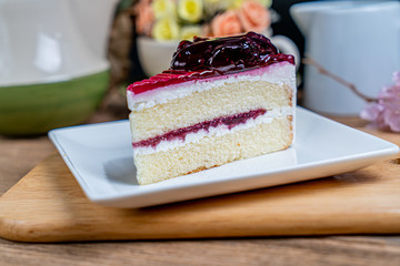 Blueburry cake on white ceramic plate