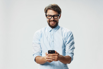 portrait of young man with mobile phone