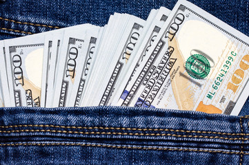 American dollar bills in jeans pocket background