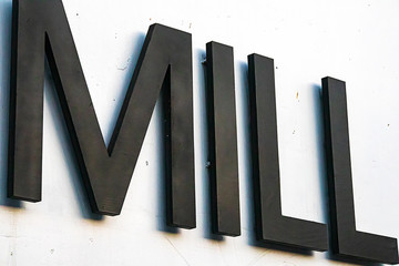 sign large dynamic bold letters spelling the word mill © Taya