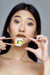 young woman with chopsticks