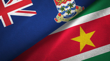 Cayman Islands and Suriname two flags textile cloth, fabric texture