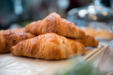 Croissant placed on a white tray